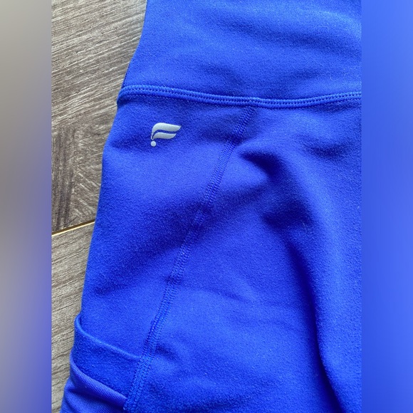 Fabletics Powerhold Royal Blue Cropped Leggings w/ mesh side cutout and pockets - Picture 6 of 8